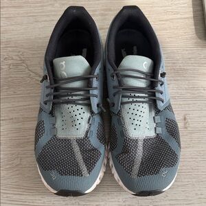 On Running Blue and Black Athletic Shoes